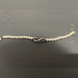 Pearl and rhinestone infinity symbol bracelet. NWOT